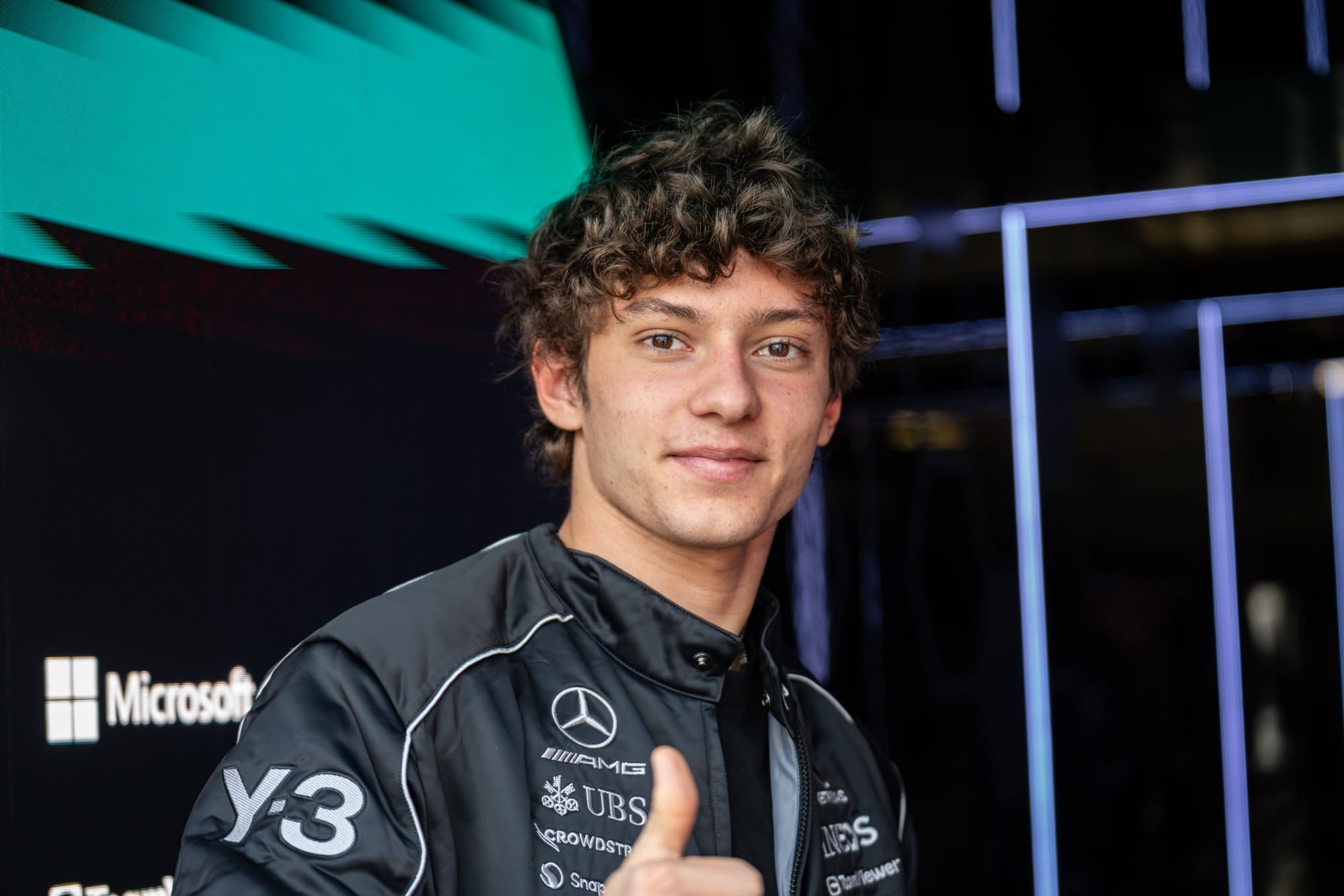 Kimi Antonelli gives a thumbs up in the Mercedes garage at the 2026 Chinese Grand Prix