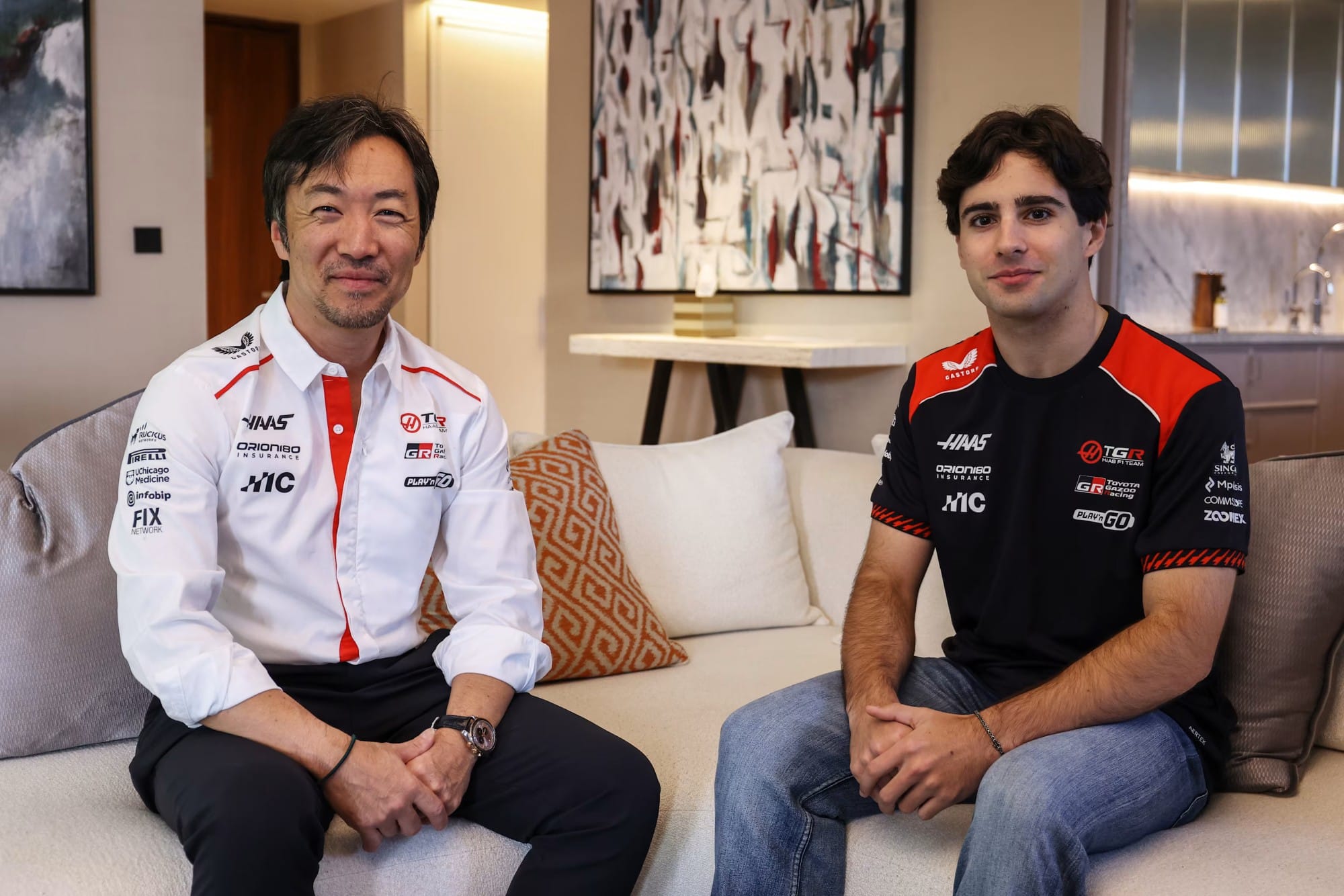 Rafael Camara with Haas Team Principal Ayao Komatsu after signing for 2027