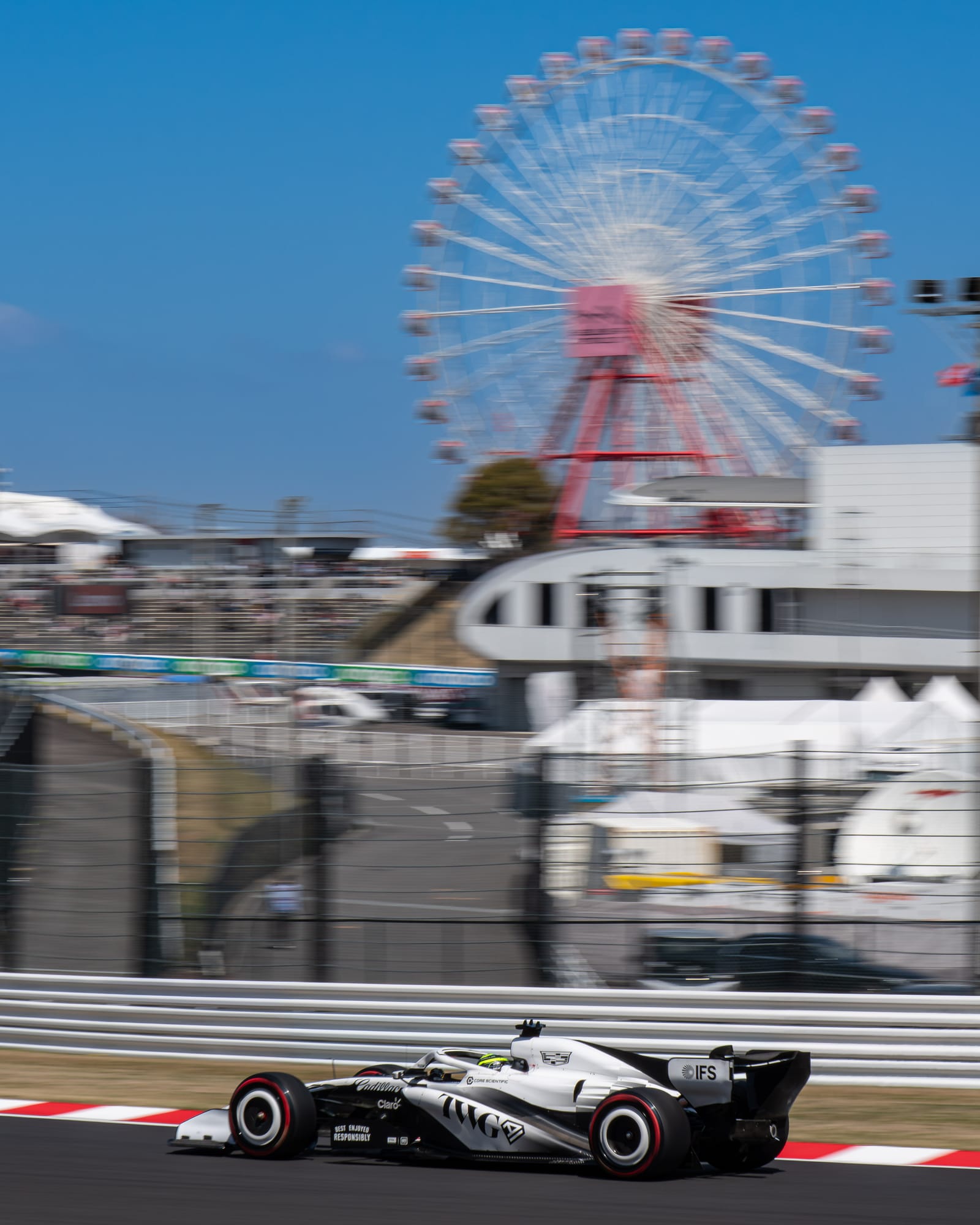 Sergio Perez drives his Cadillac past the Suzuka Ferris wheel during practice at the 2026 Japanese Grand Prix