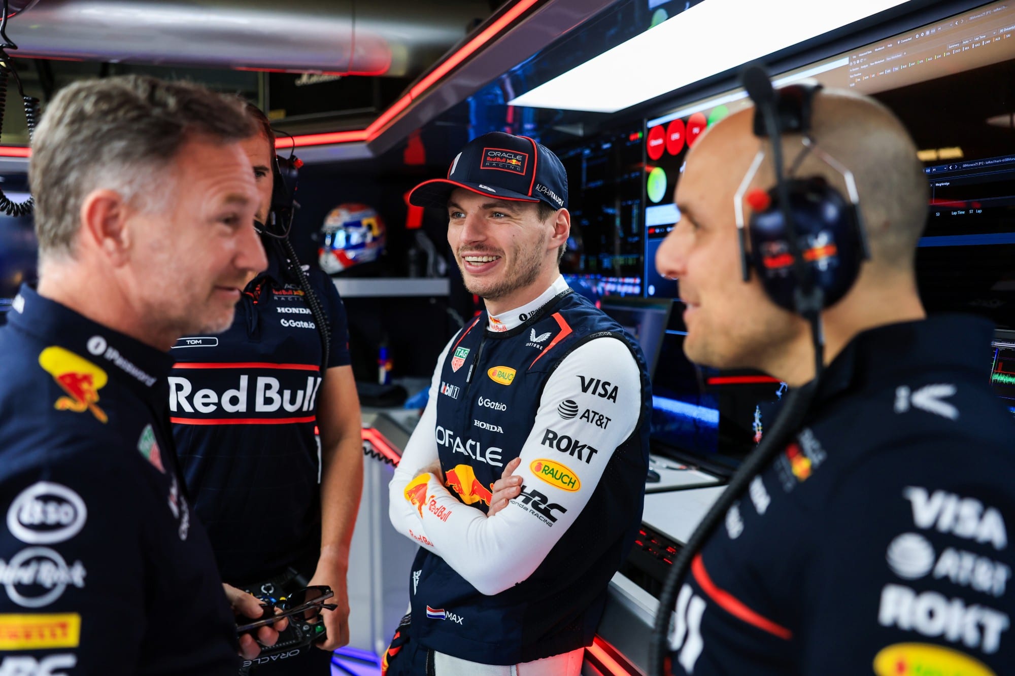 Christian Horner with Max Verstappen and Gianpiero Lambiase in the Red Bull garage at the 2025 Monaco Grand Prix
