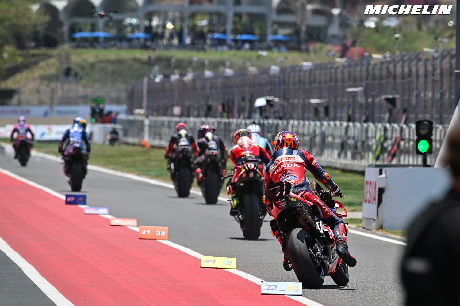Luca Marini leads MotoGP riders down the pit lane at the 2026 Indonesian Grand Prix