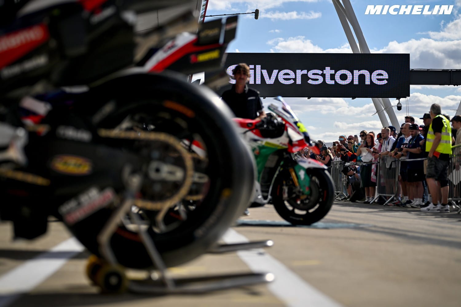 MotoGP bikes in the pit lane as fans look on at the 2026 British Grand Prix at Silverstone