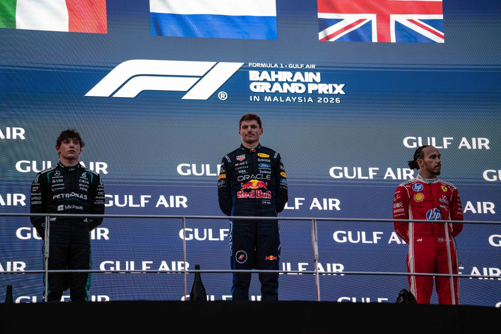 Kimi Antonelli, Max Verstappen and Lewis Hamilton on the podium at the Bahrain Grand Prix in Malaysia
