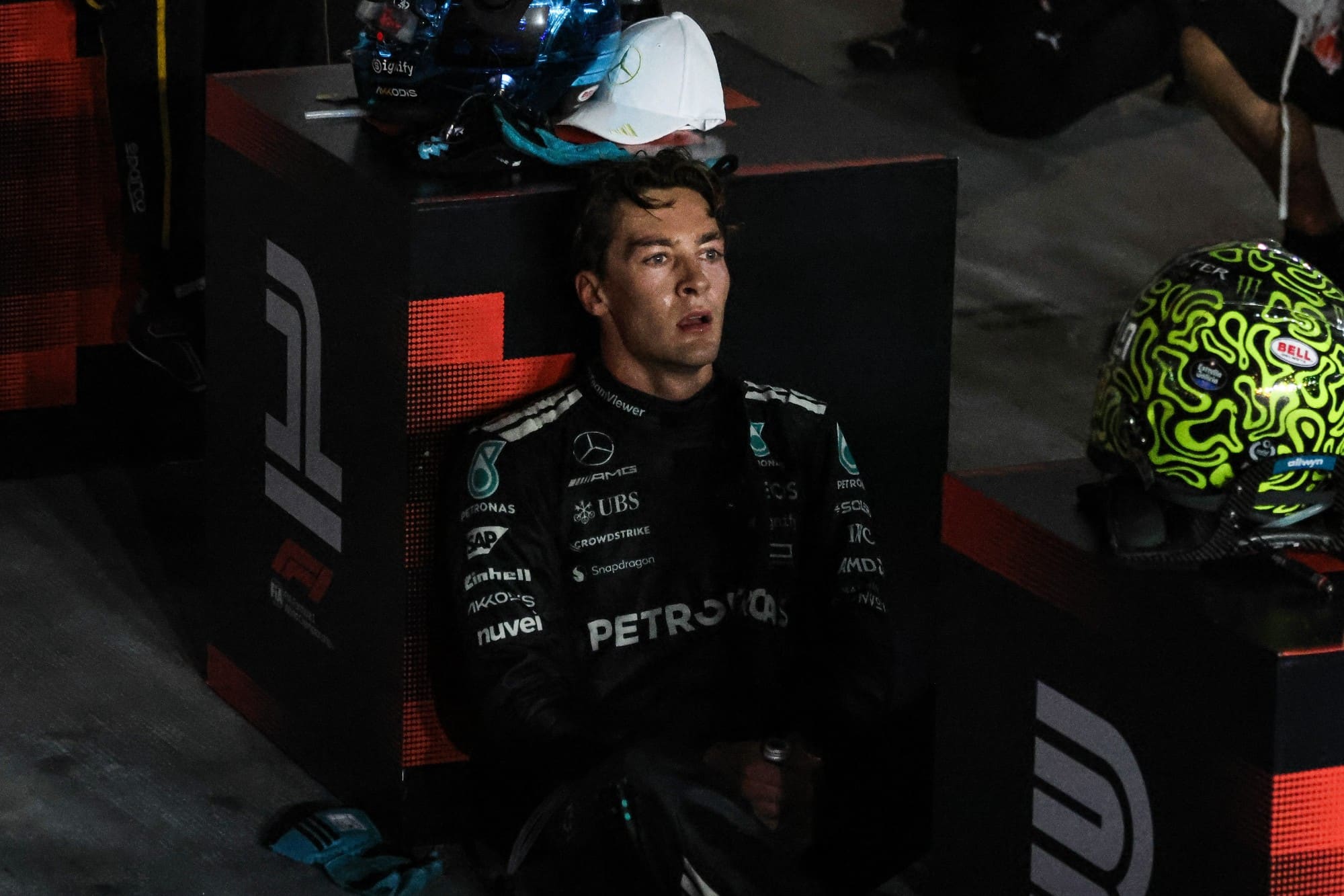 George Russell sits by the P1 board in parc ferme after winning the 2025 Singapore Grand Prix