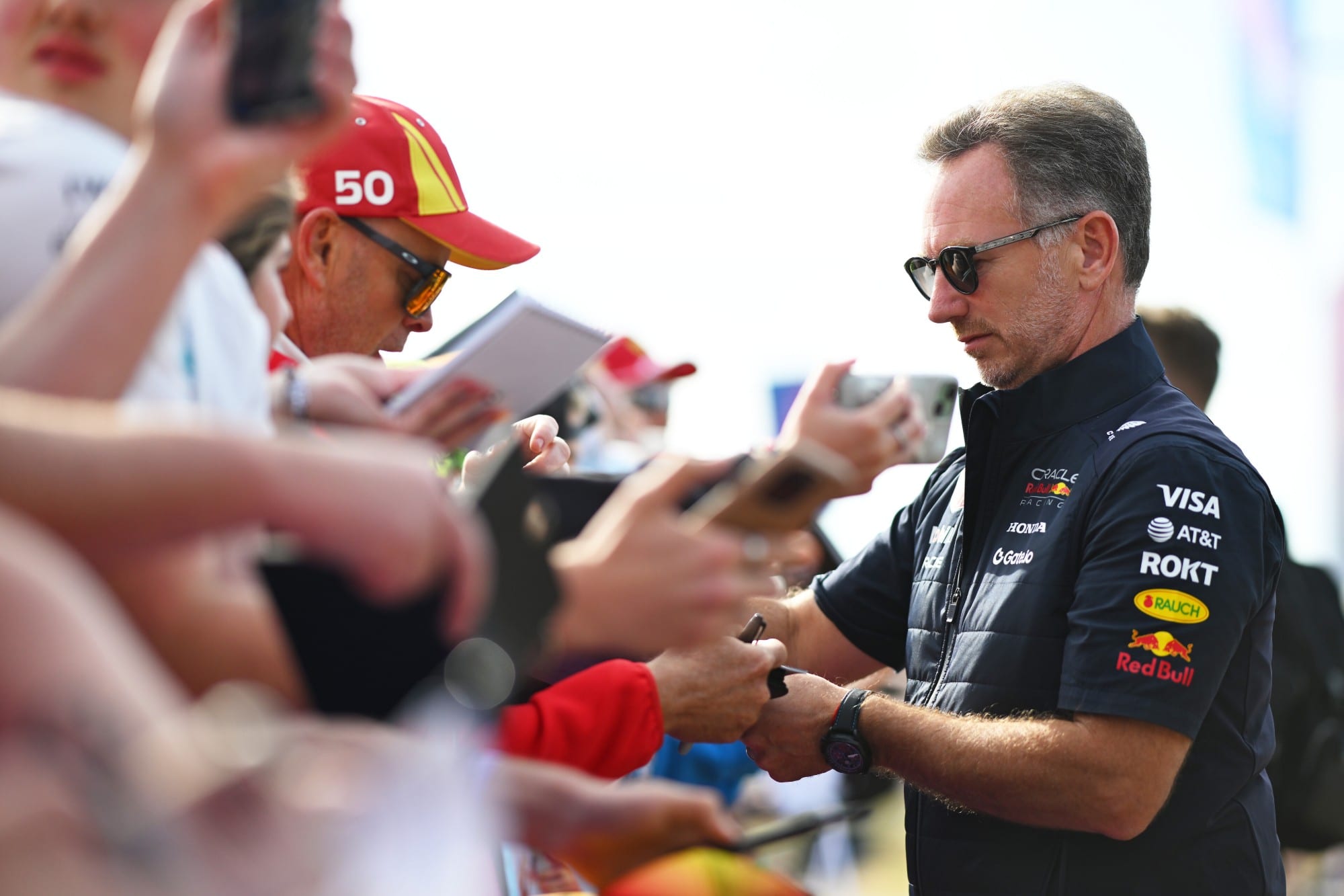 Christian Horner signing autographs for fans at the 2025 British Grand Prix