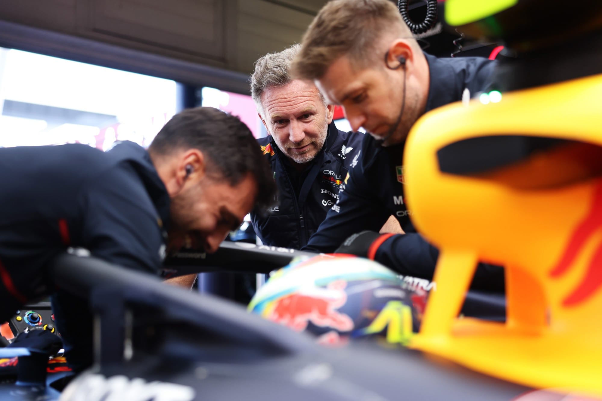 Christian Horner watching Arvid Lindblad in the Red Bull garage at the 2025 British Grand Prix
