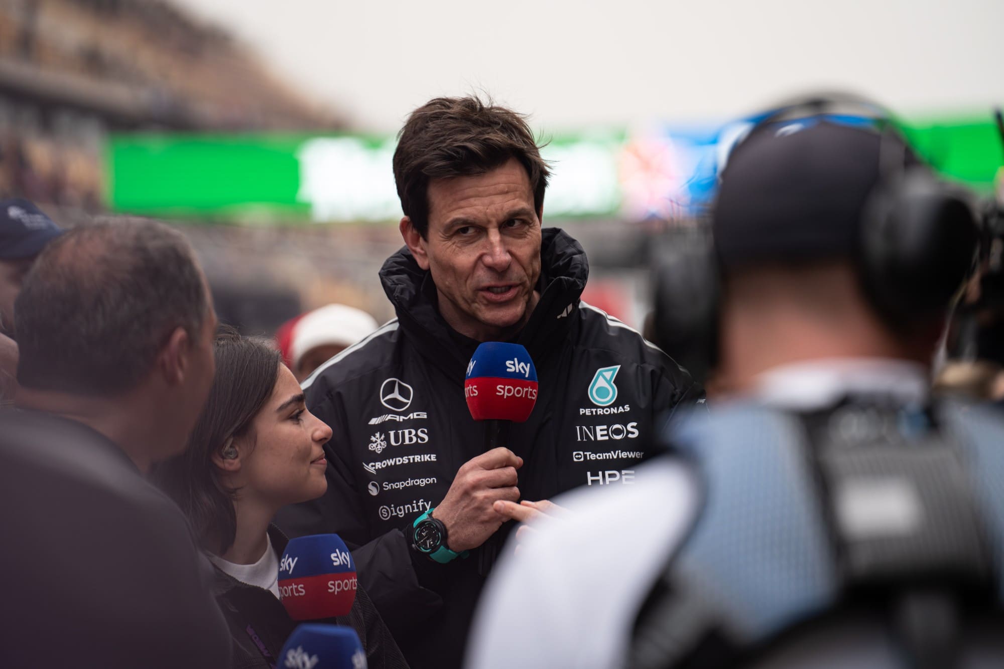 Mercedes team principal Toto Wolff talks to TV reporters on the grid
