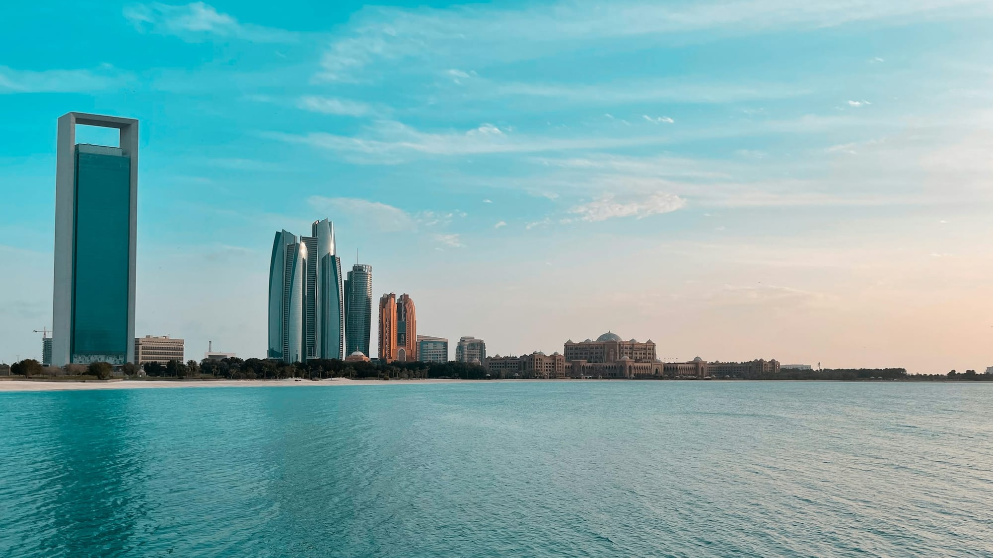 The Etihad Towers on the Abu Dhabi skyline across the water