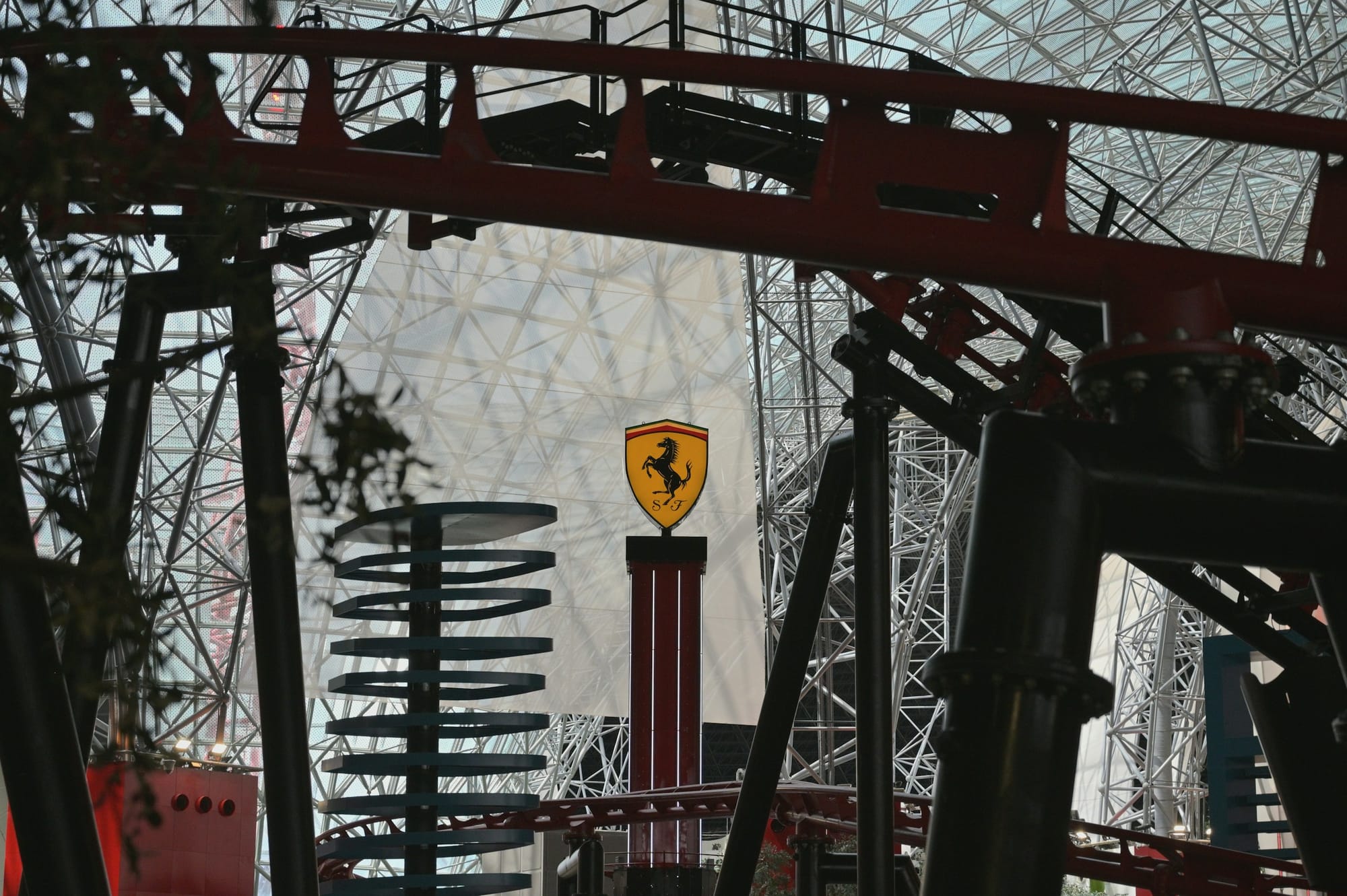 A roller coaster and the Ferrari badge at Ferrari World on Yas Island