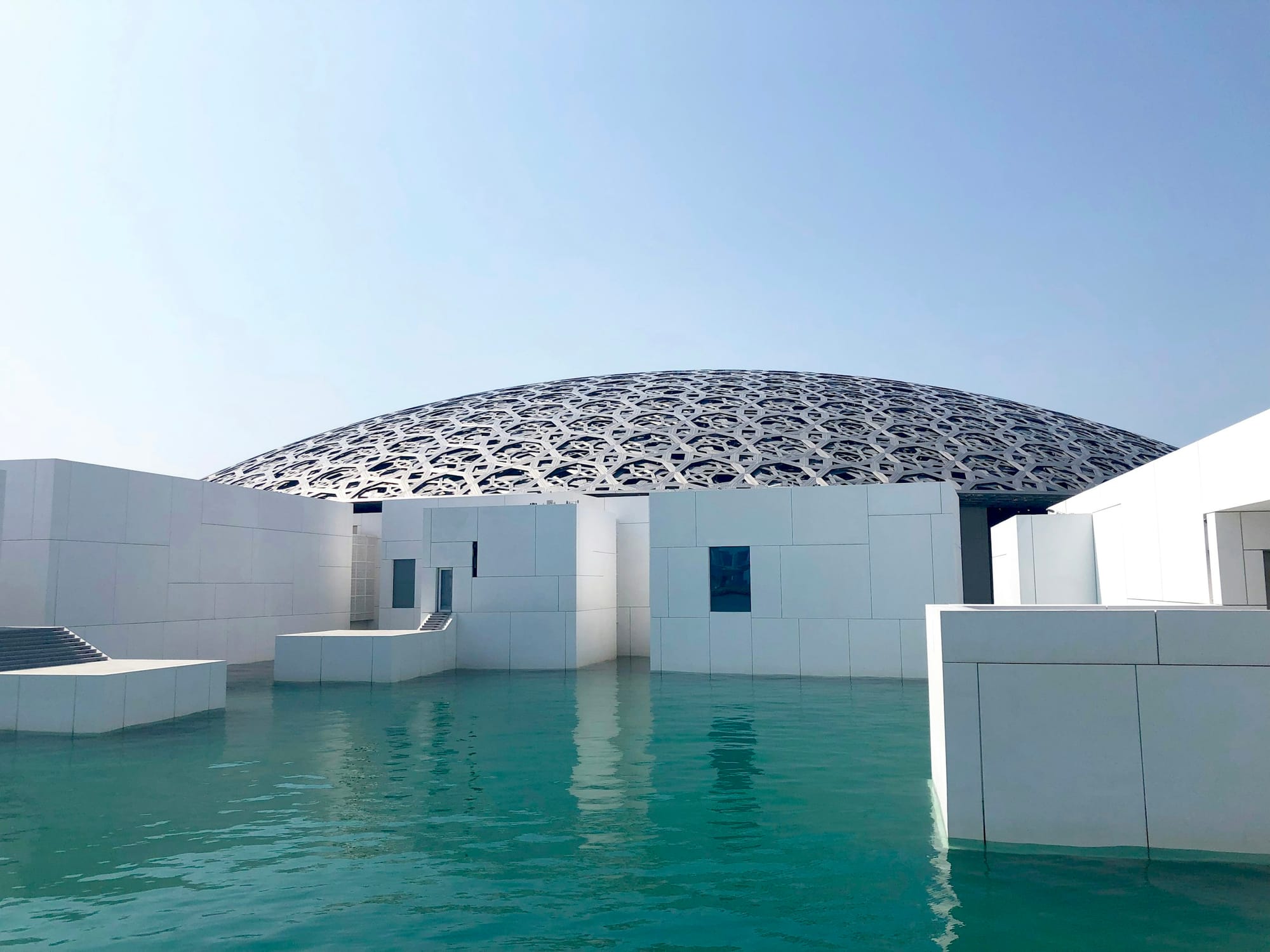 The Louvre Abu Dhabi and its dome above the water on Saadiyat Island