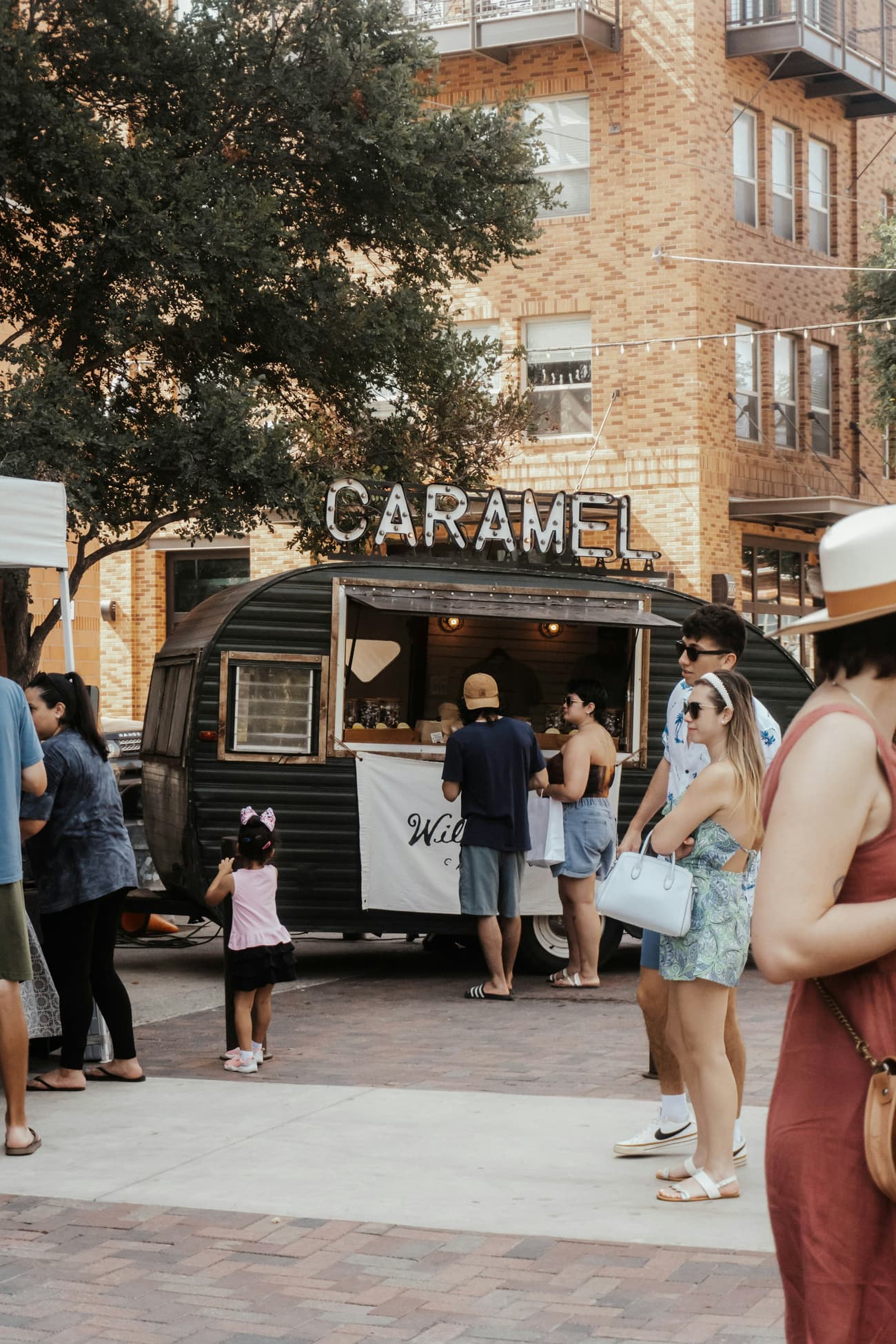 People queue at a food trailer in Austin