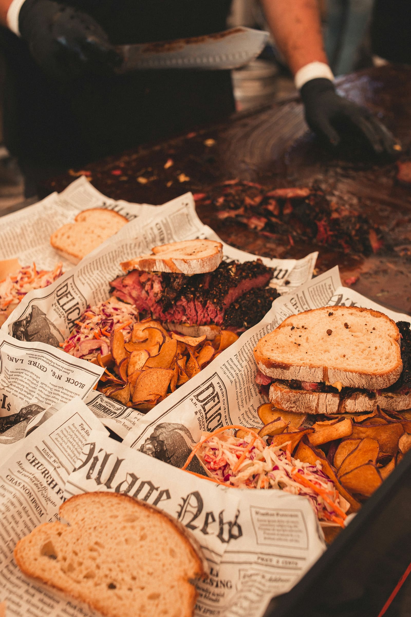 A tray of barbecue with brisket, bread and sides
