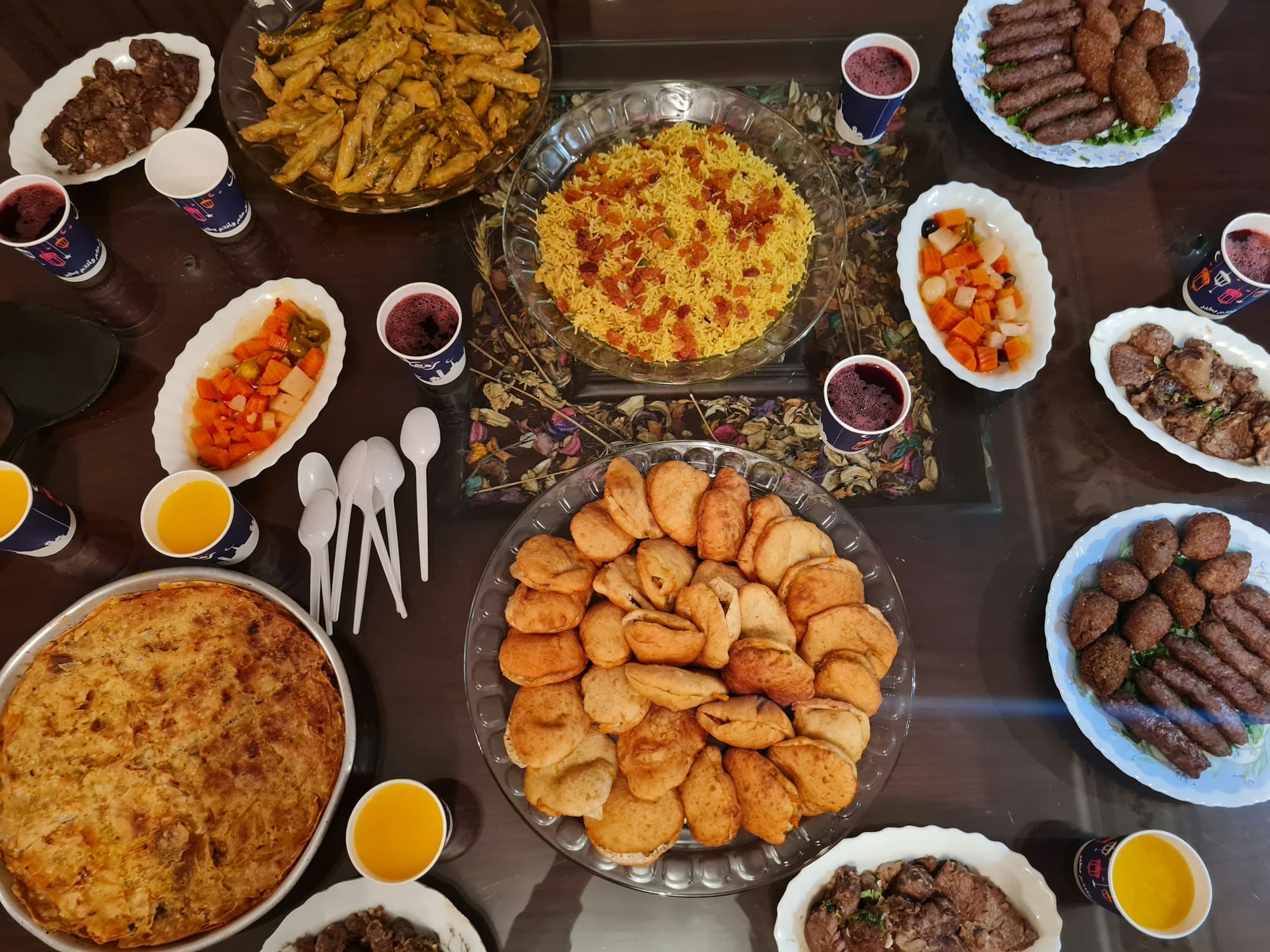 A table of Arabic dishes, kebabs and rice