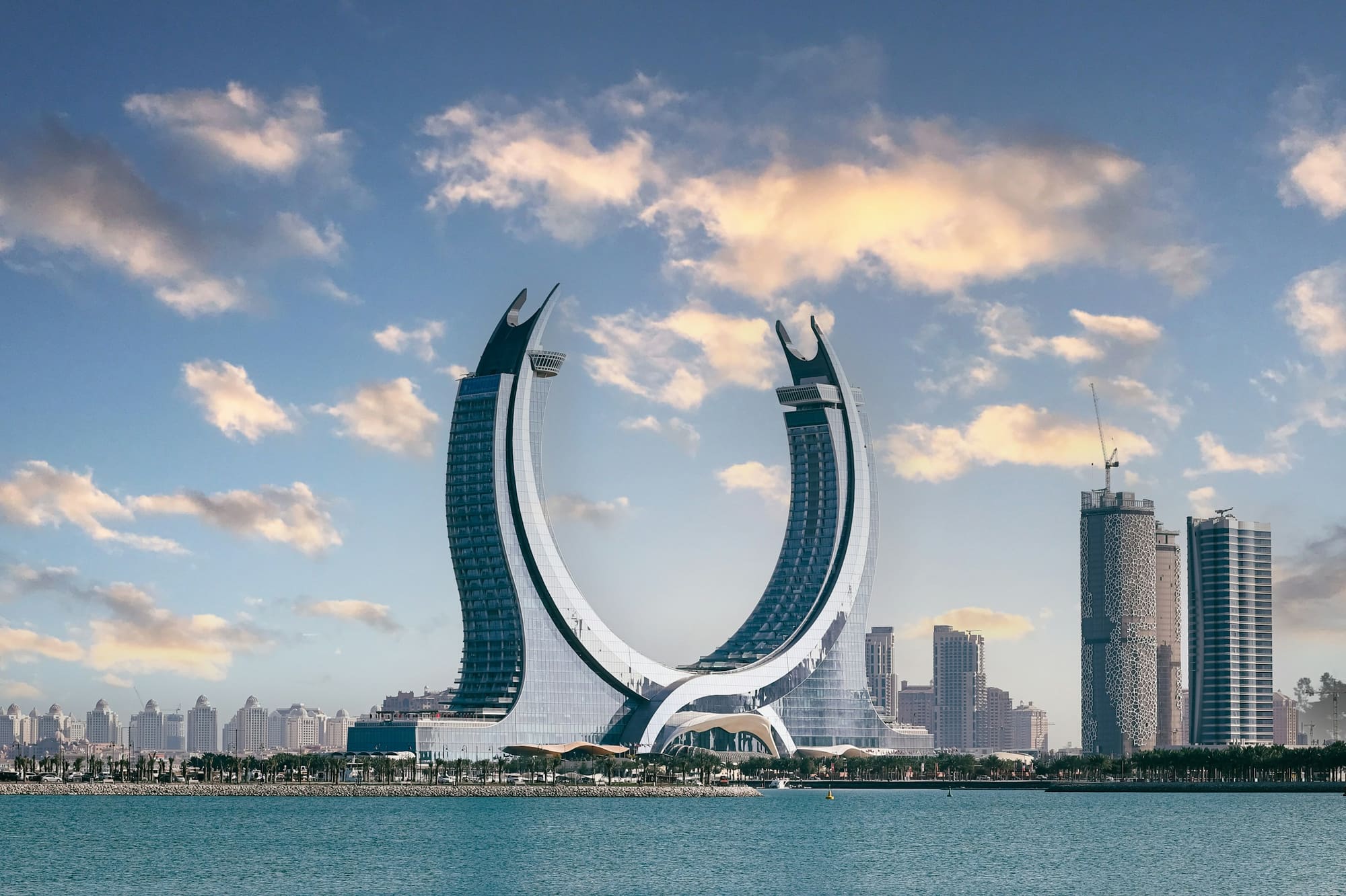 The crescent-shaped Katara Towers on the waterfront in Lusail