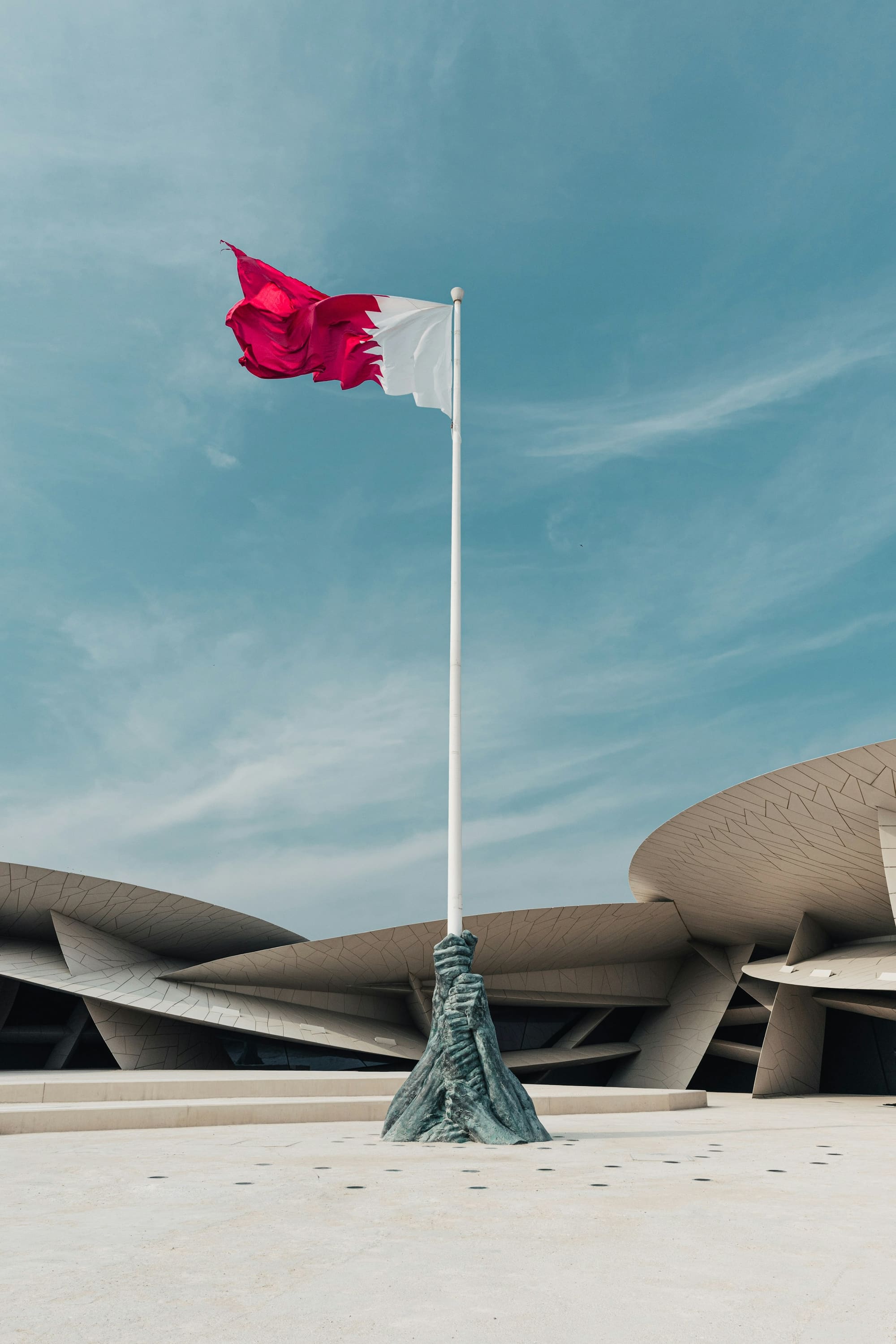 The Qatari flag flying above the National Museum of Qatar